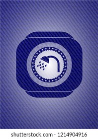shower icon inside emblem with jean background