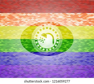 shower icon inside emblem on mosaic background with the colors of the LGBT flag