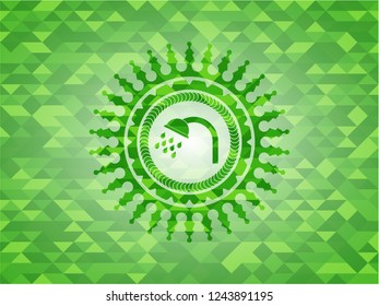 shower icon inside green emblem with triangle mosaic background
