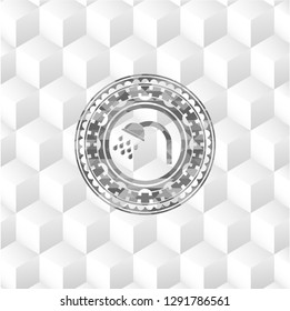 shower icon inside grey badge with geometric cube white background