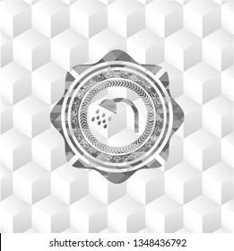 shower icon inside grey emblem with geometric cube white background