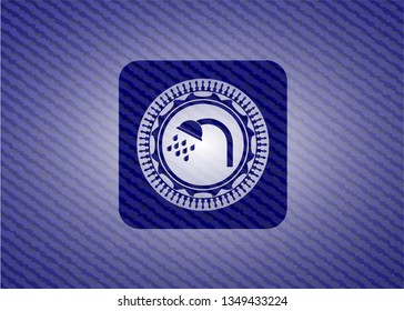 shower icon inside jean or denim emblem or badge background
