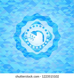 shower icon inside light blue mosaic emblem