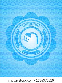 shower icon inside light blue water wave style emblem.