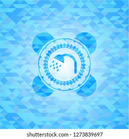shower icon inside realistic light blue mosaic emblem