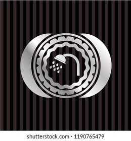 shower icon inside silver emblem or badge