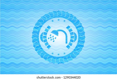 shower icon inside sky blue water emblem background.