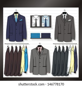 In a show-window of shop the business clothes for men are placed