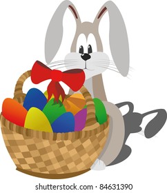 Shy easter rabbit sits near the basket with colorfull eggs