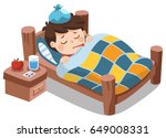 Sick cute boy sleep in bed with a thermometer in mouth and feel so bad with fever.
