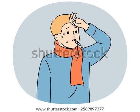 Sick flu boy with thermometer in mouth touching forehead with fever and in need antibiotics to fight infection. Sick child suffers from disease caused by hypothermia and problems with immune system