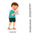 Sick little boy suffering from flu or cold allergy symptom sneezing on a handkerchief or tissue paper