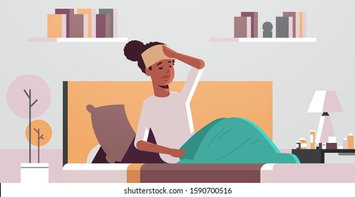 sick woman with wet towel on forehead unhealthy african american girl reducing high fever suffering from cold flu virus illness concept modern living room interior portrait horizontal vector