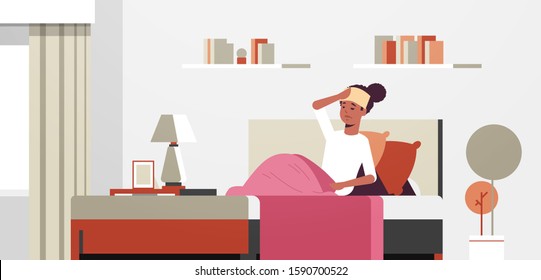 sick woman with wet towel on forehead unhealthy african american girl reducing high fever suffering from cold flu virus illness concept modern living room interior full length horizontal vector