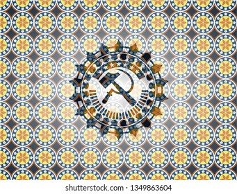 sickle and hammer icon inside arabesque emblem. arabic decoration.