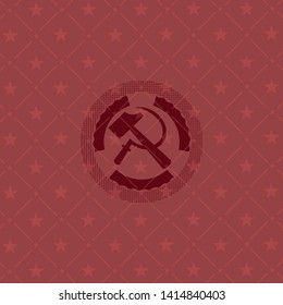 sickle and hammer icon inside badge with red background