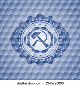 sickle and hammer icon inside blue polygonal badge.