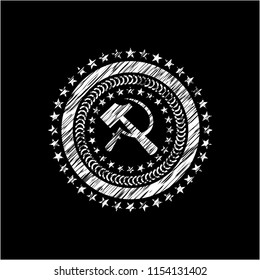 sickle and hammer icon inside chalkboard emblem written on a blackboard