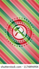 sickle and hammer icon inside christmas emblem background.