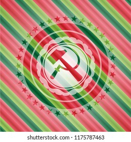 sickle and hammer icon inside christmas style badge..