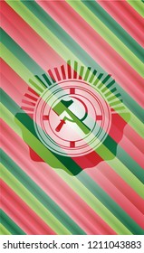 sickle and hammer icon inside christmas style badge..