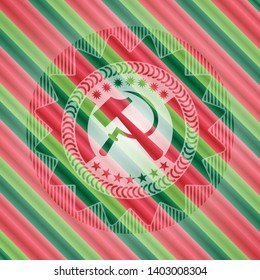 sickle and hammer icon inside christmas colors style emblem.