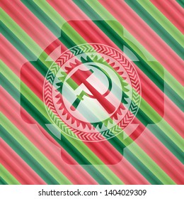 sickle and hammer icon inside christmas colors badge.