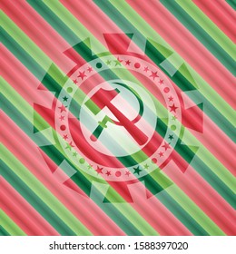 sickle and hammer icon inside christmas colors style emblem.