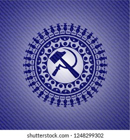 sickle and hammer icon inside denim background