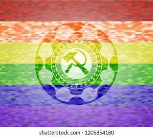 sickle and hammer icon inside emblem on mosaic background with the colors of the LGBT flag