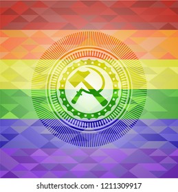 sickle and hammer icon inside emblem on mosaic background with the colors of the LGBT flag