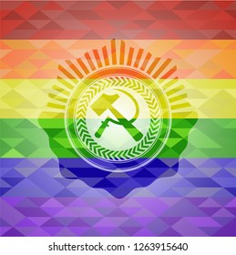 sickle and hammer icon inside emblem on mosaic background with the colors of the LGBT flag