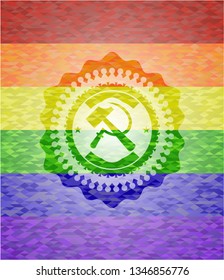 sickle and hammer icon inside emblem on mosaic background with the colors of the LGBT flag