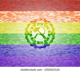 sickle and hammer icon inside emblem on mosaic background with the colors of the LGBT flag