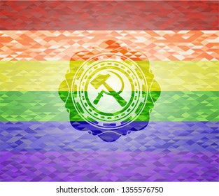 sickle and hammer icon inside emblem on mosaic background with the colors of the LGBT flag