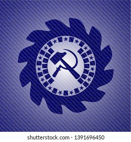 sickle and hammer icon inside emblem with denim texture