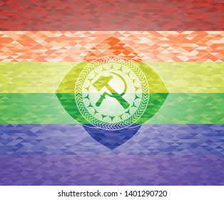 sickle and hammer icon inside emblem on mosaic background with the colors of the LGBT flag