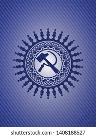 sickle and hammer icon inside emblem with denim high quality background