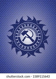 sickle and hammer icon inside emblem with jean texture