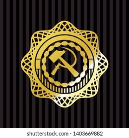 sickle and hammer icon inside gold badge or emblem