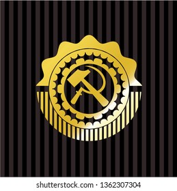 sickle and hammer icon inside golden badge