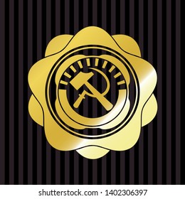 sickle and hammer icon inside golden emblem