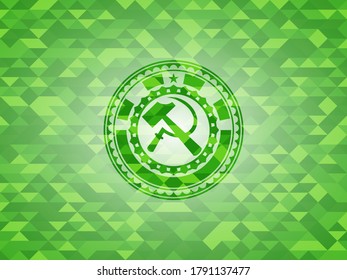 sickle and hammer icon inside green emblem with mosaic ecological style background. 