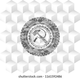 sickle and hammer icon inside grey badge with geometric cube white background