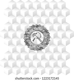 sickle and hammer icon inside grey emblem with cube white background