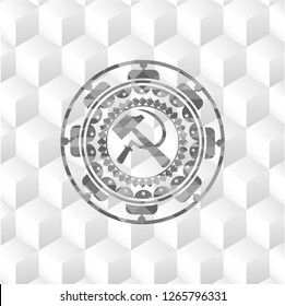 sickle and hammer icon inside grey badge with geometric cube white background