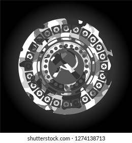 sickle and hammer icon inside grey camouflage texture