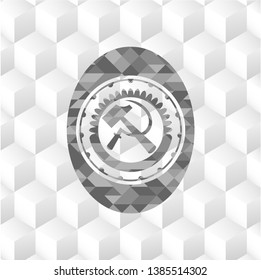 sickle and hammer icon inside grey badge with geometric cube white background