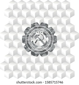 sickle and hammer icon inside grey badge with geometric cube white background