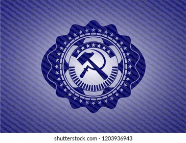 sickle and hammer icon inside jean or denim emblem or badge background